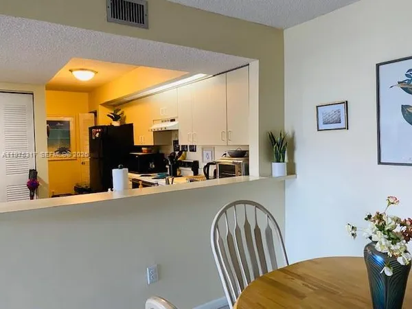 a view of a living room and dining room
