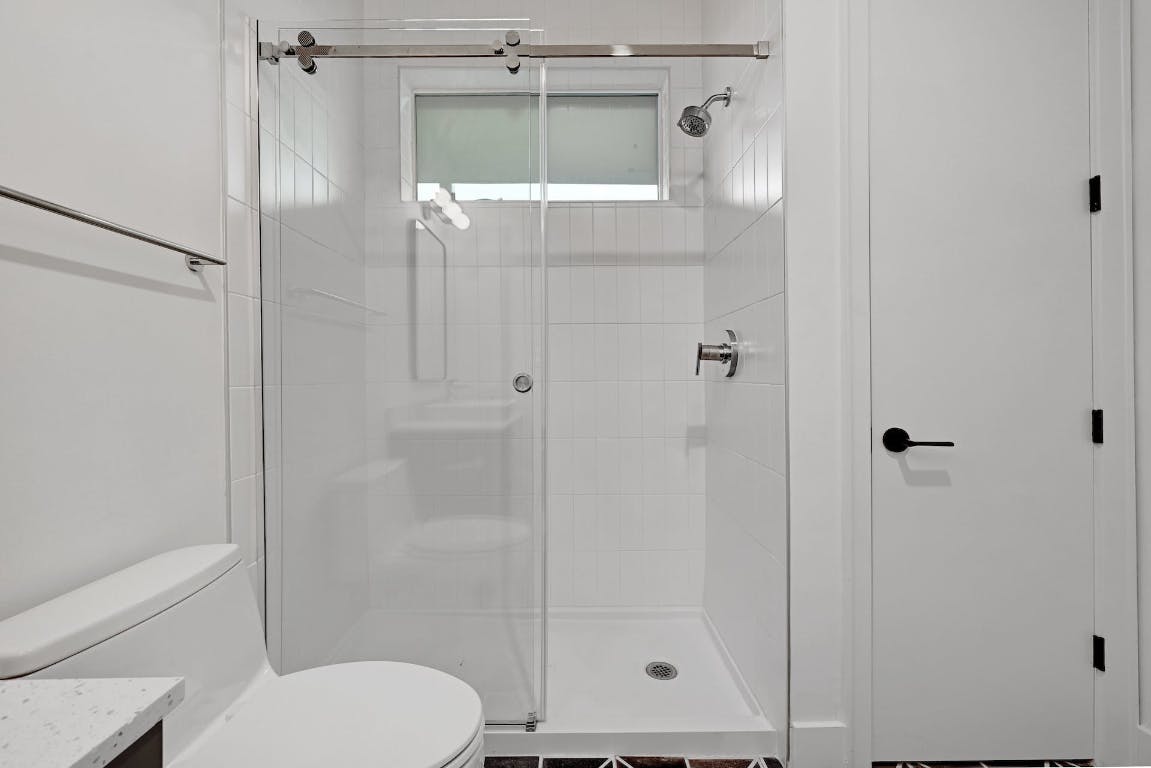 2709 East 5th Street, Unit 1303 Austin, TX 78702 - Photo 12 of 18 a bathroom with a shower and a toilet