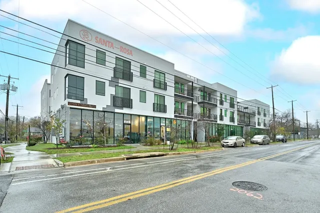 a view of a building with a street