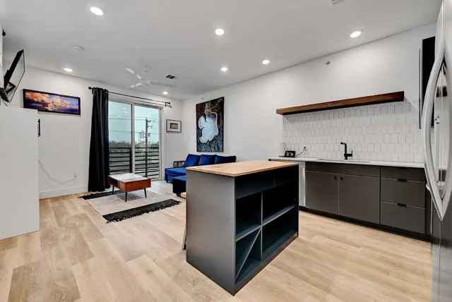 a kitchen with a sink and cabinets