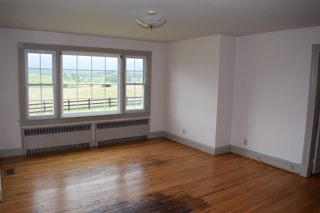 1800 Duke Road Waynesboro, VA 22980 - Photo 21 of 41 an empty room with wooden floor and windows
