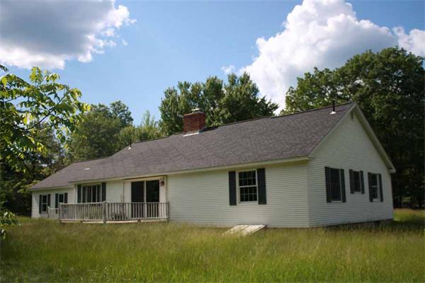 945 Old Dana Road Barre, MA 01005 - Photo 3 of 19 a front view of house with yard and green space