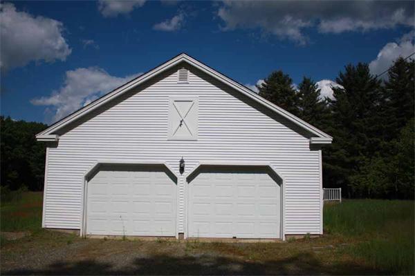 945 Old Dana Road Barre, MA 01005 - Photo 4 of 19 a front view of a house with a yard