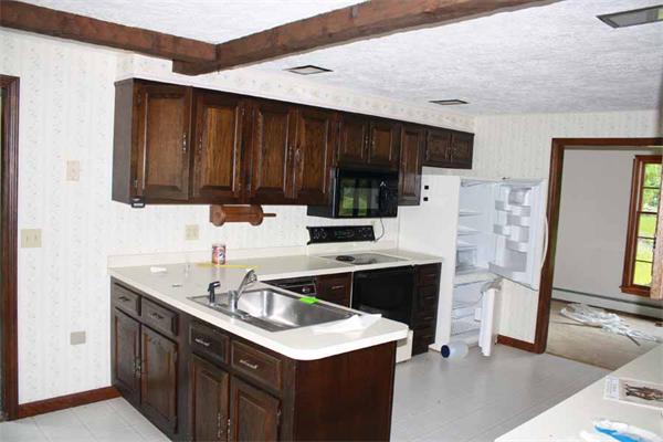 945 Old Dana Road Barre, MA 01005 - Photo 6 of 19 a kitchen with a sink and a refrigerator