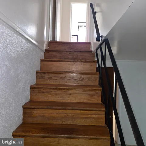 a view of an empty room with stairs
