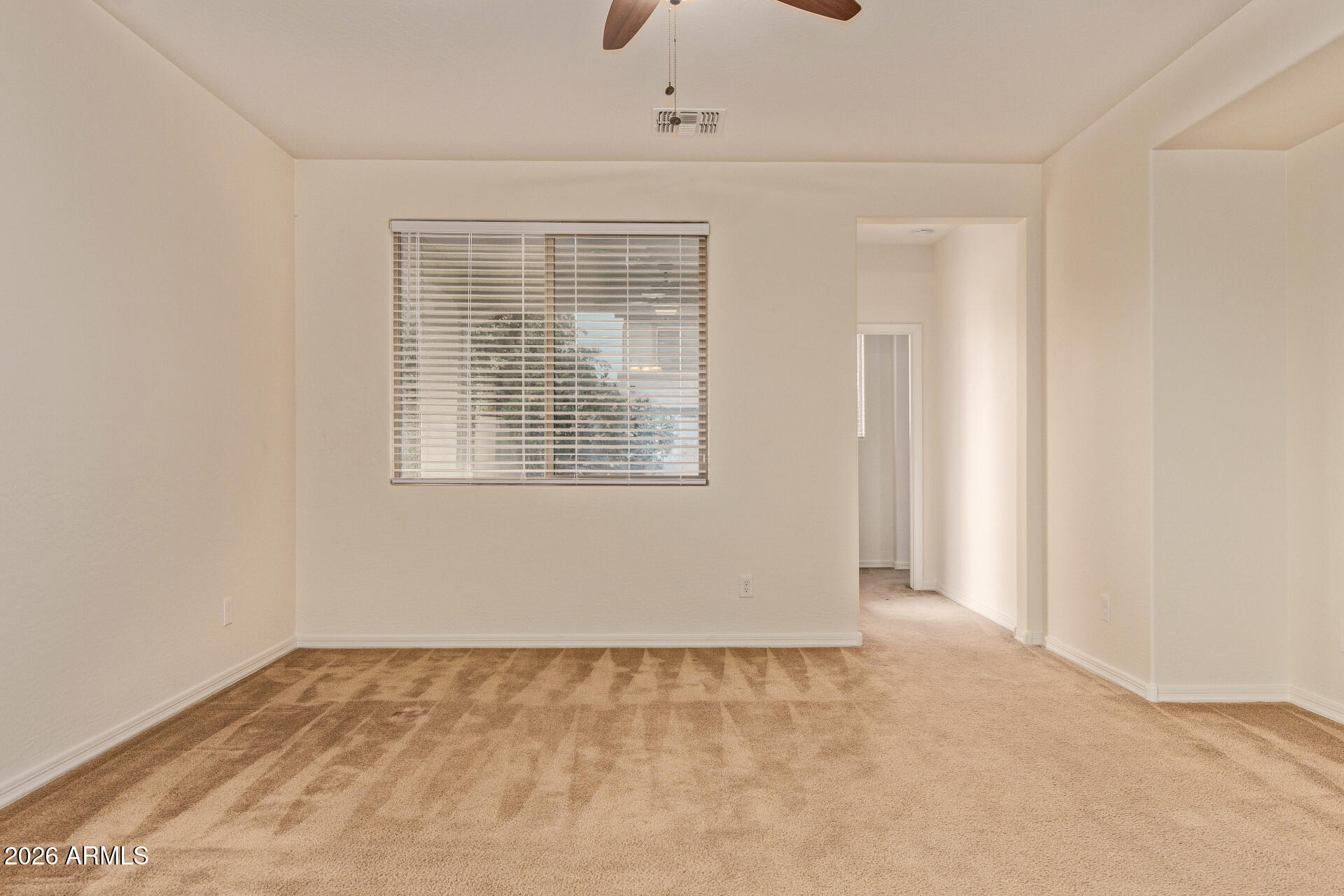 41334 West Rio Bravo Drive Maricopa, AZ 85138 - Photo 20 of 43 a view of an empty room with a window