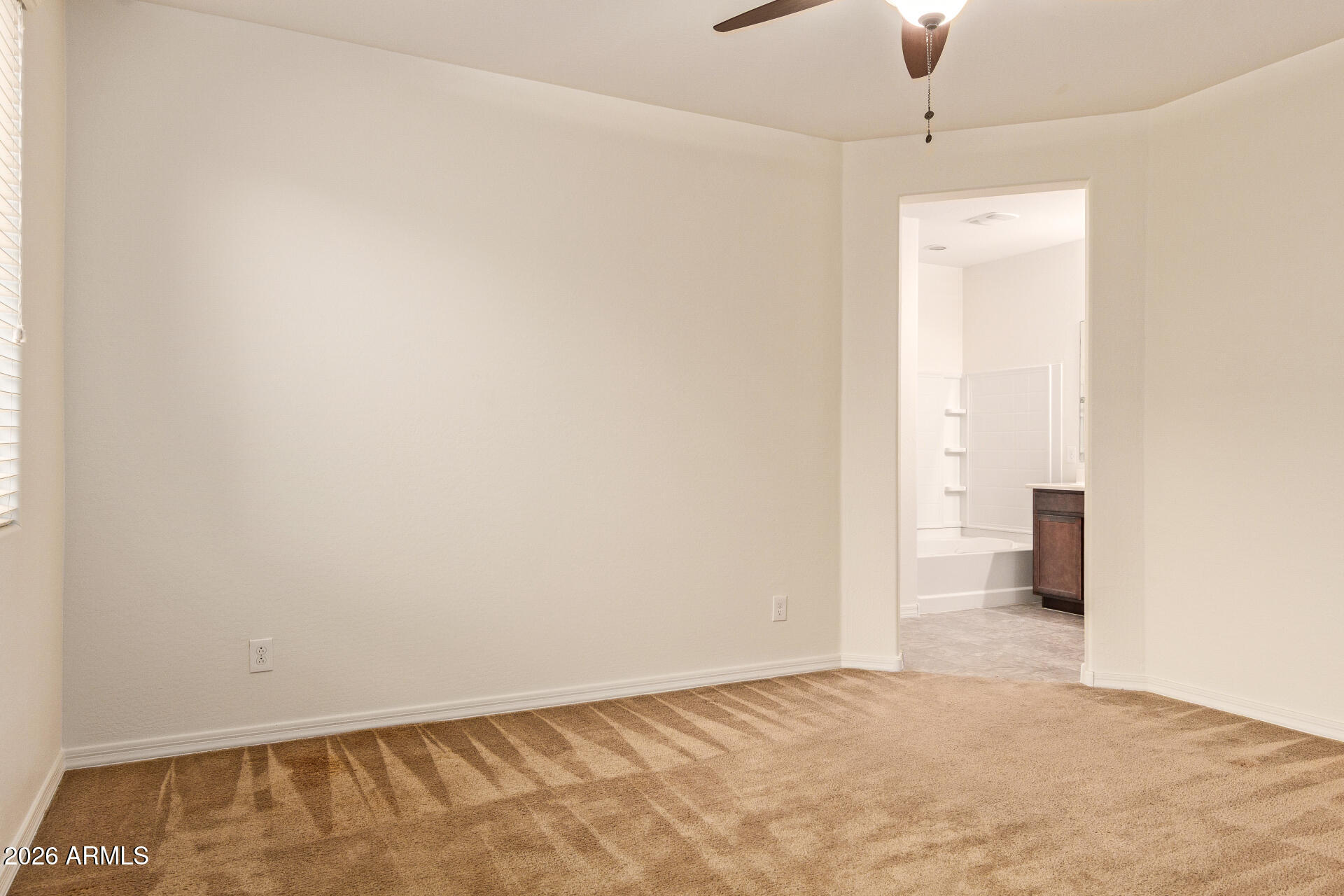 41334 West Rio Bravo Drive Maricopa, AZ 85138 - Photo 21 of 43 an empty room with an entryway