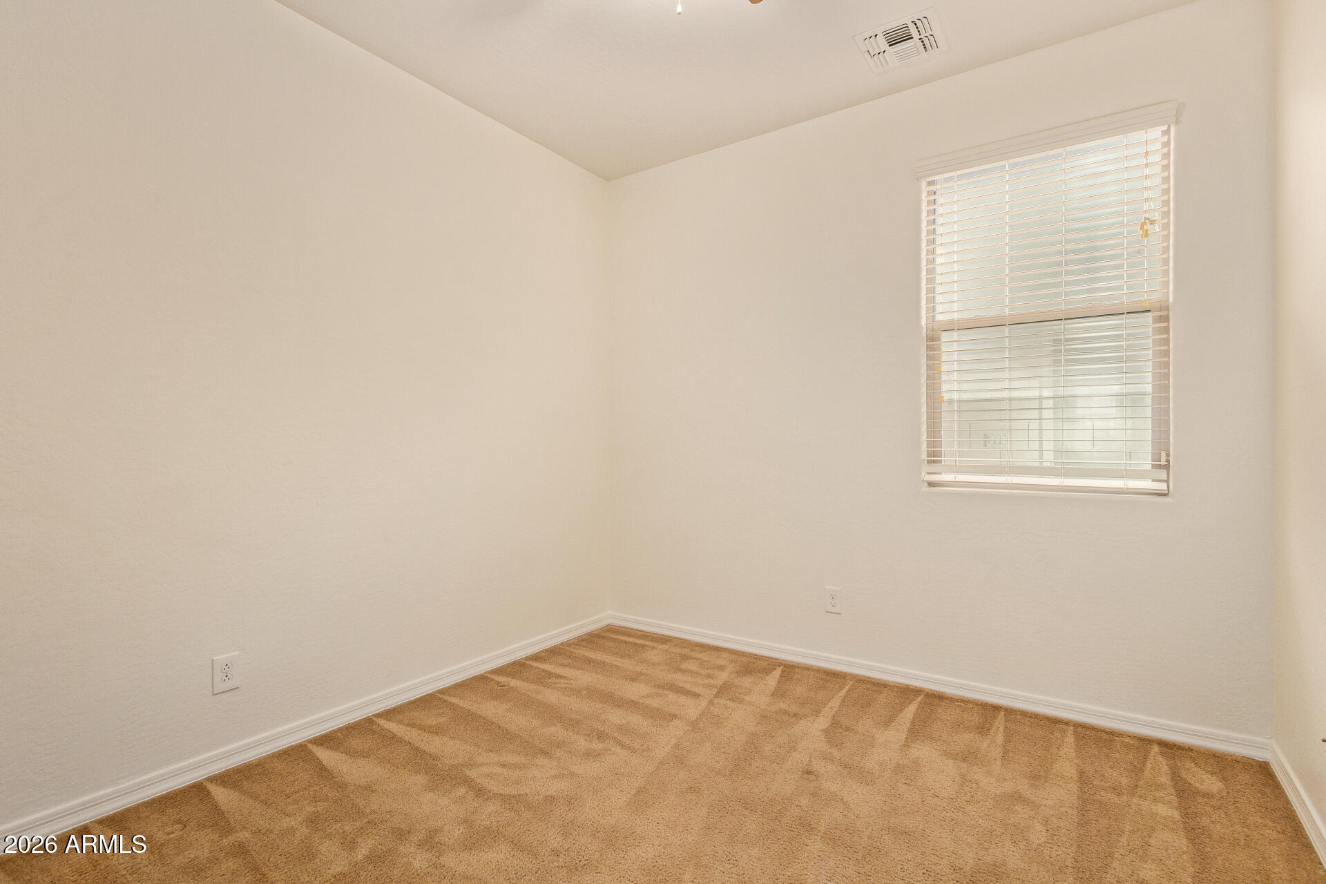 41334 West Rio Bravo Drive Maricopa, AZ 85138 - Photo 27 of 43 an empty room with a window