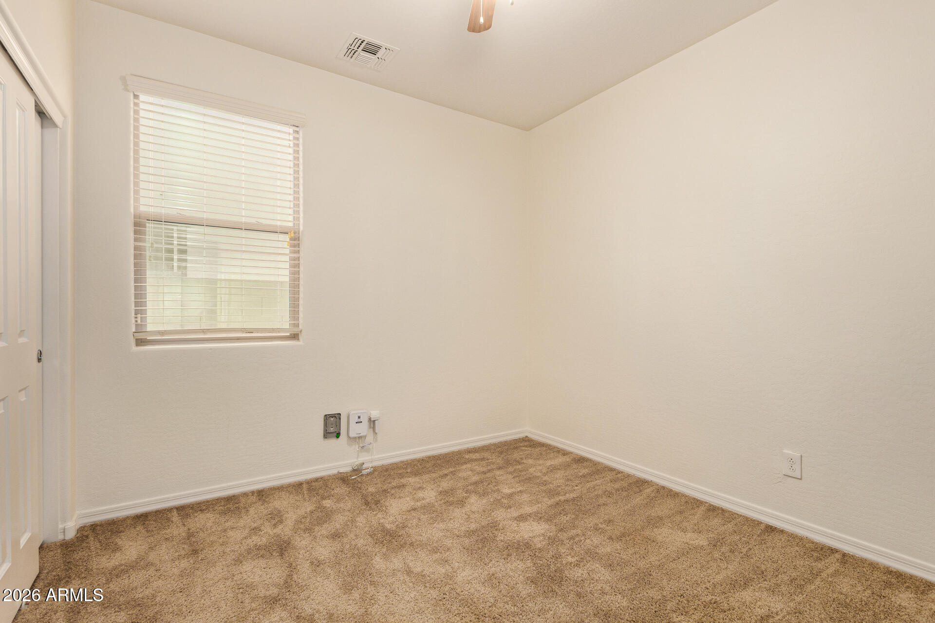 41334 West Rio Bravo Drive Maricopa, AZ 85138 - Photo 29 of 43 an empty room with a window