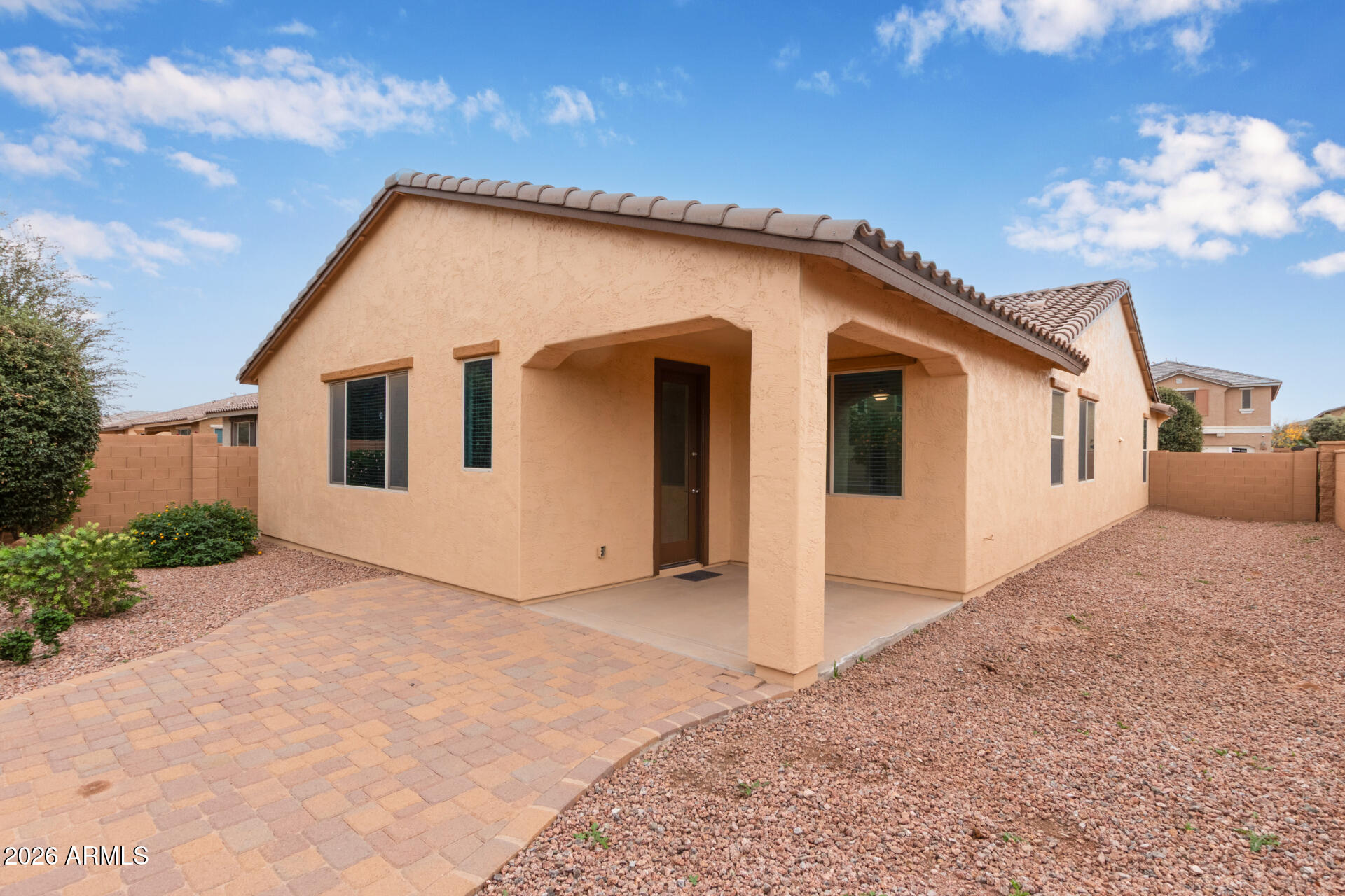 41334 West Rio Bravo Drive Maricopa, AZ 85138 - Photo 3 of 43 a view of a house with a backyard
