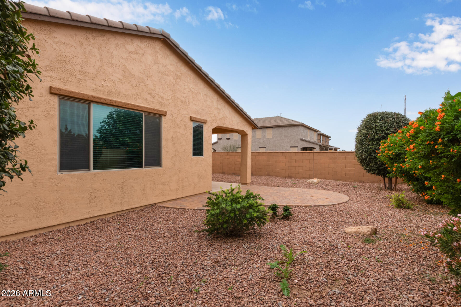 41334 West Rio Bravo Drive Maricopa, AZ 85138 - Photo 39 of 43 a front view of a house with a yard