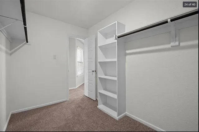 a view of an empty walk in closet