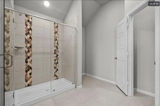 a bathroom with a shower and a tub