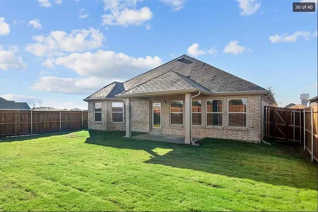 a view of a house with a yard and swimming pool