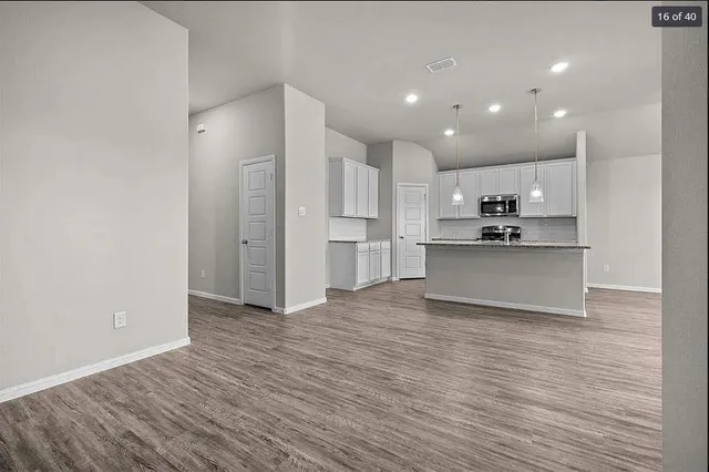 a view of kitchen with wooden floor