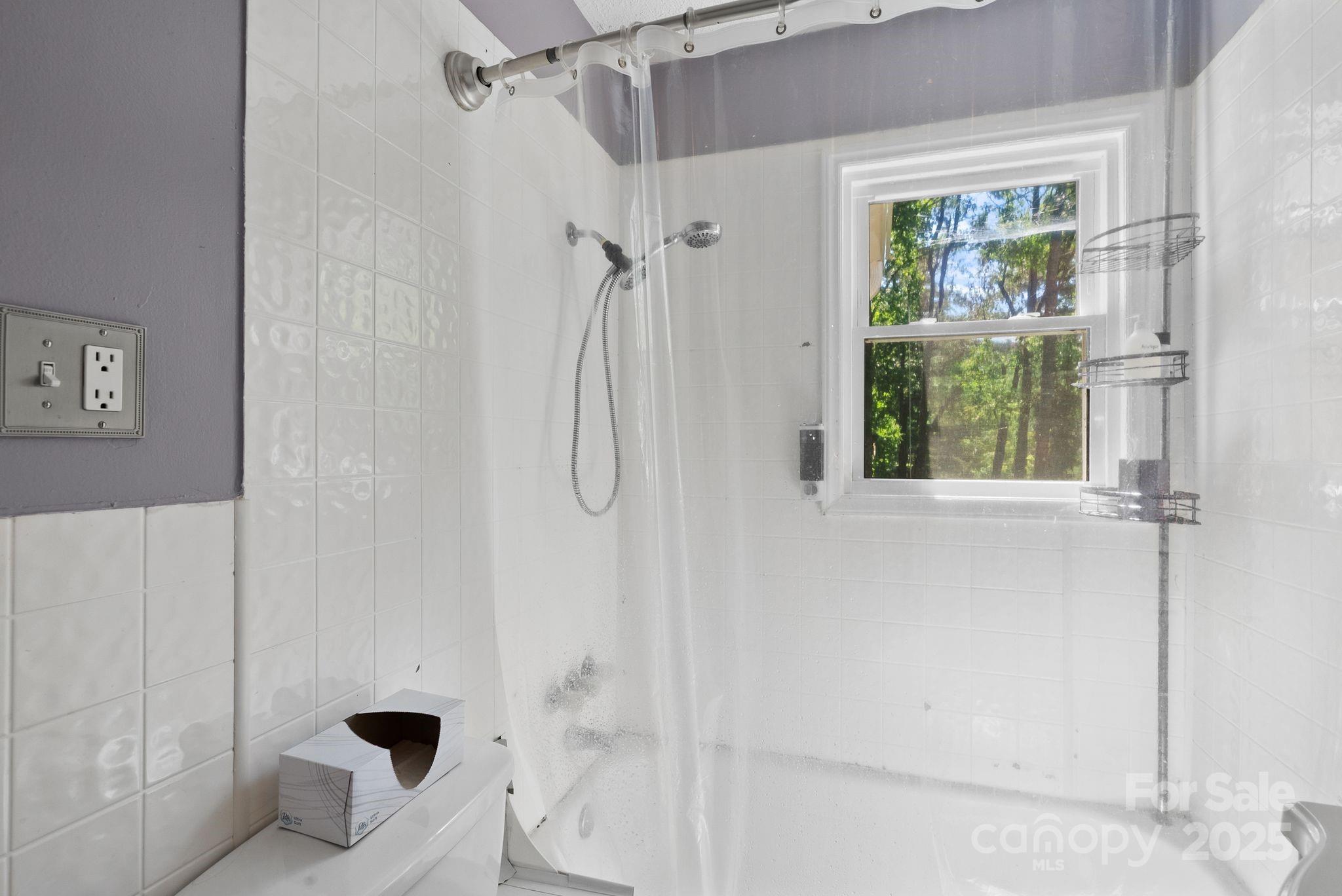1215 Upper Brush Creek Road Fairview, NC 28730 - Photo 21 of 41 a bathroom with a bathtub and shower