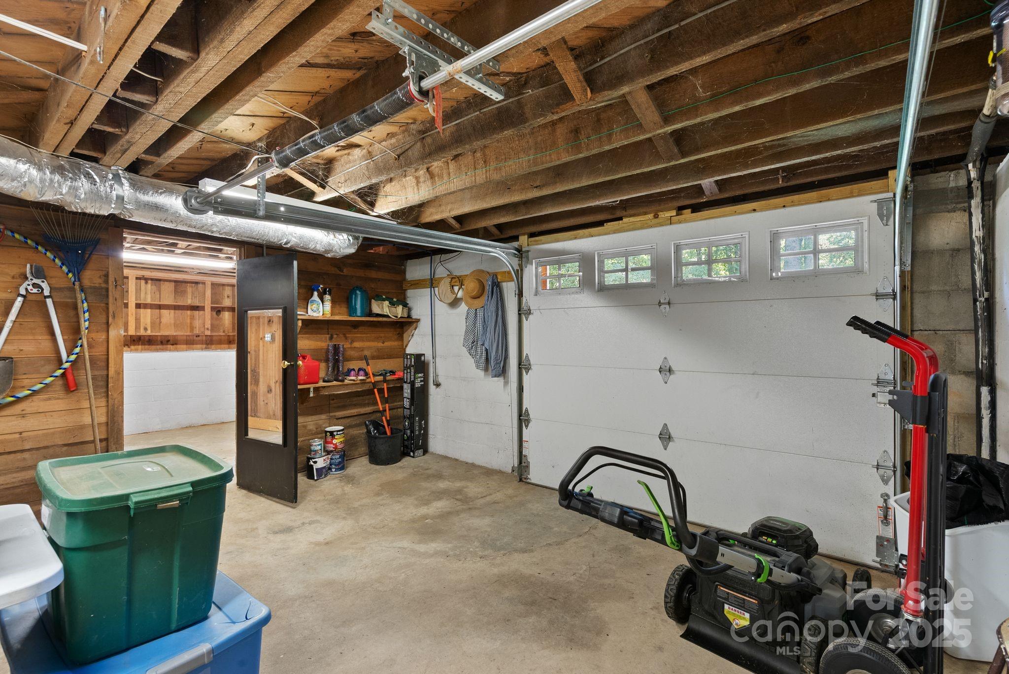 1215 Upper Brush Creek Road Fairview, NC 28730 - Photo 25 of 41 a room with lots of storage and utility