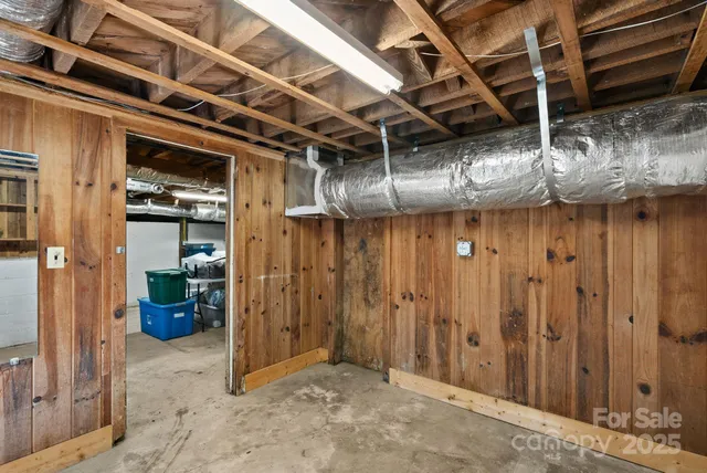 a view of a room with wooden walls