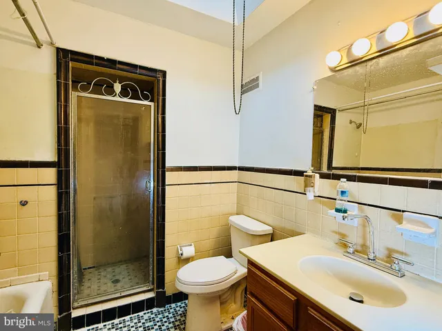 a view of an empty room and wooden floor