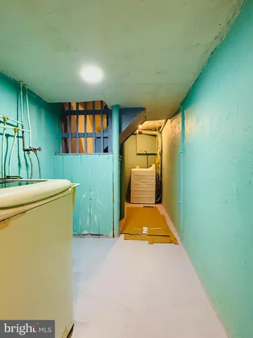 a view of a room with furniture and washer