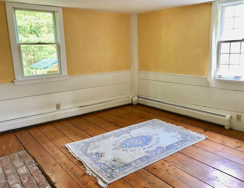 117 Colrain Stage Road Heath, MA 01346 - Photo 22 of 41 a view of a room with wooden floor and bench