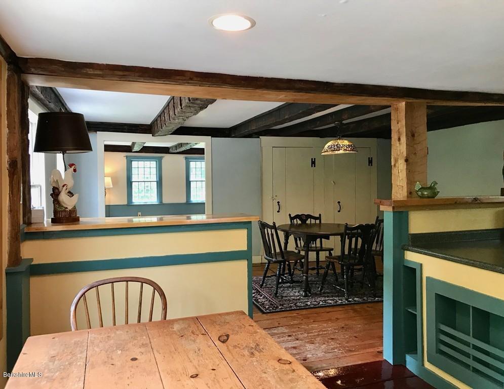 117 Colrain Stage Road Heath, MA 01346 - Photo 7 of 41 a view of a hallway with dining room and stairs