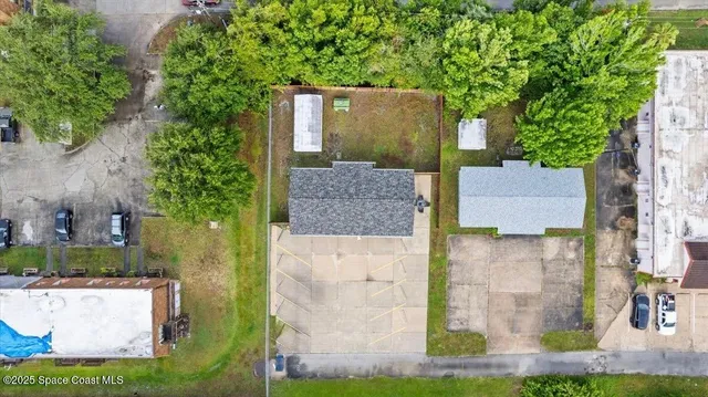 a view of a backyard with chairs