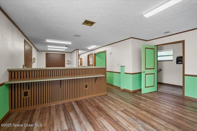a view of livingroom with furniture and hardwood floor