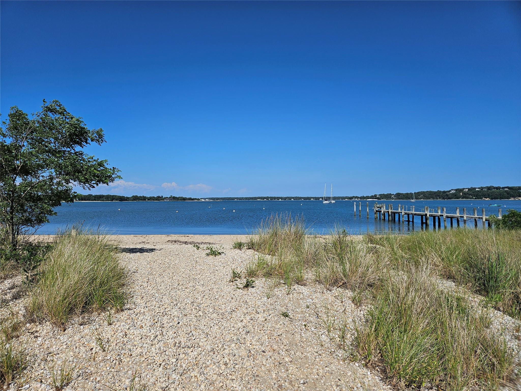 3650 Bay Shore Road Greenport, NY 11944 - Photo 2 of 30 a view of a lake with a mountain in the background