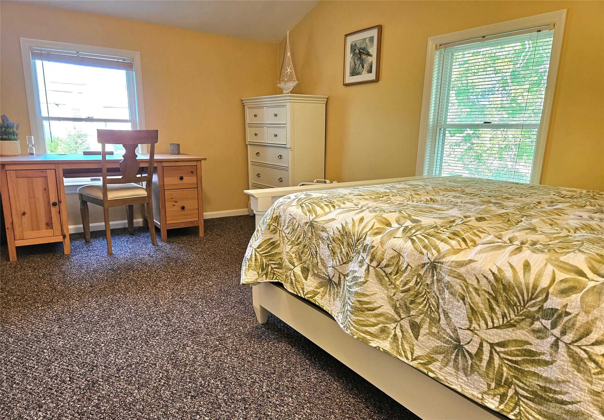 3650 Bay Shore Road Greenport, NY 11944 - Photo 25 of 30 a bed sitting in a bedroom next to a window
