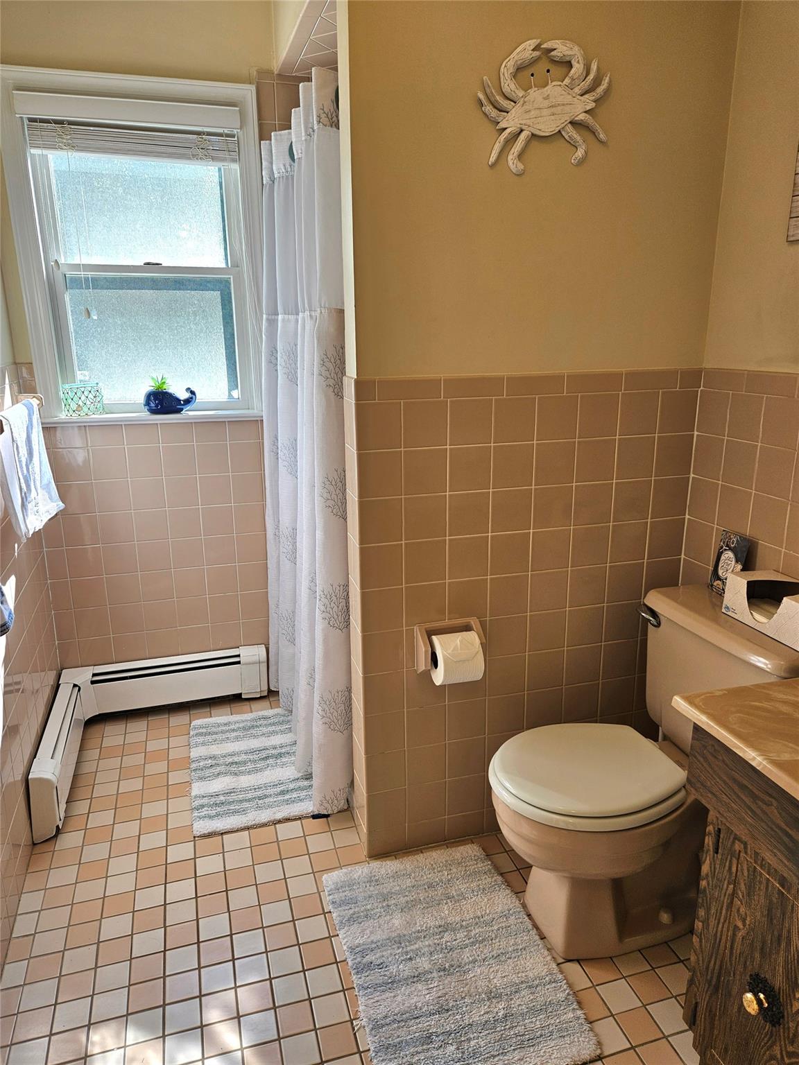 3650 Bay Shore Road Greenport, NY 11944 - Photo 30 of 30 a bathroom with a toilet and a mirror