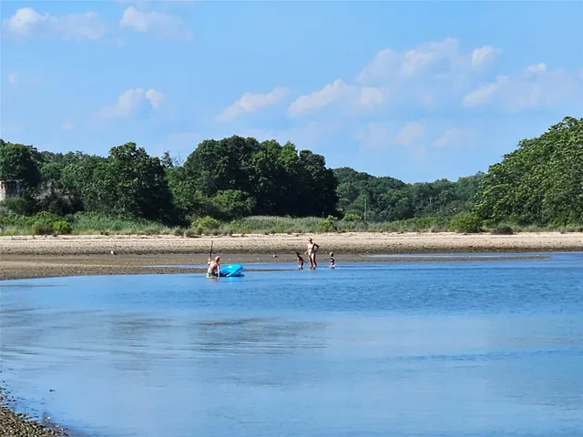 a living room with furniture fireplace and a flat screen tv