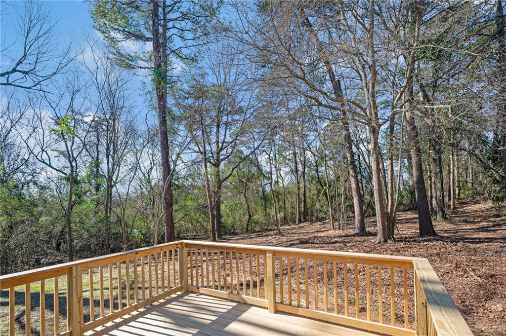 789 Buck Boulevard Southeast Calhoun, GA 30701 - Photo 13 of 14 a view of a wooden deck with trees