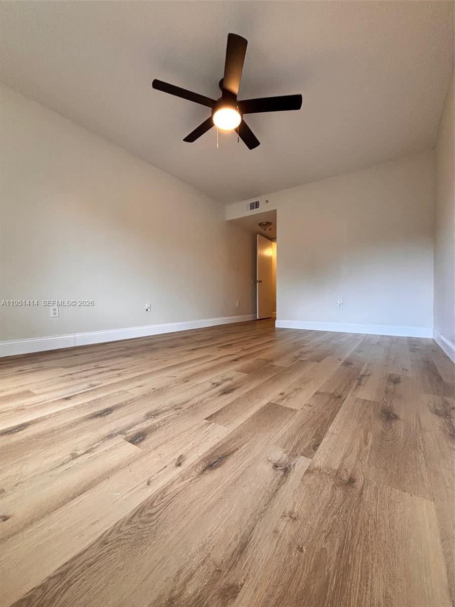 450 South Park Road, Unit 5104 Hollywood, FL 33021 - Photo 13 of 23 wooden floor in an empty room