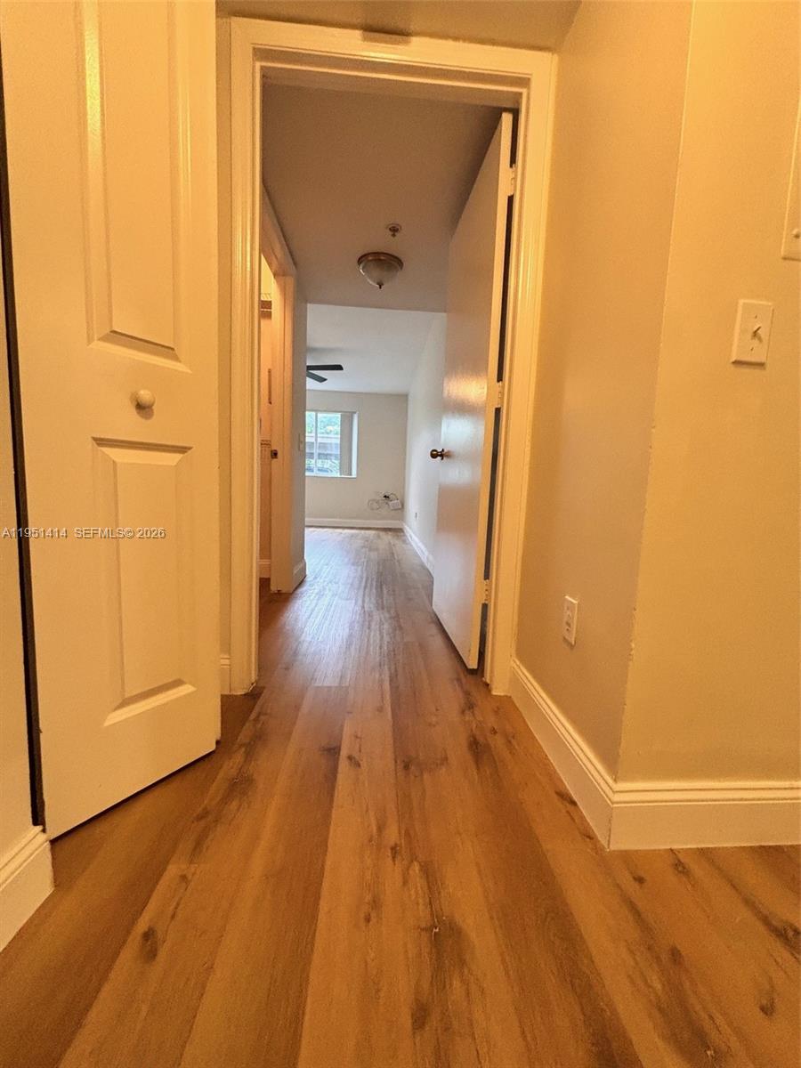 450 South Park Road, Unit 5104 Hollywood, FL 33021 - Photo 15 of 23 a view of a hallway with wooden floor and staircase