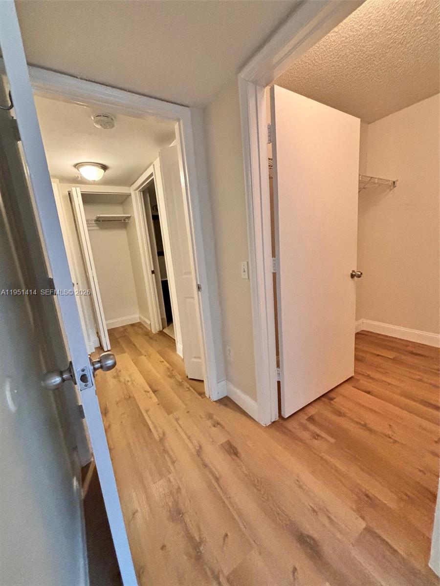 450 South Park Road, Unit 5104 Hollywood, FL 33021 - Photo 16 of 23 a view of a hallway with wooden floor and staircase