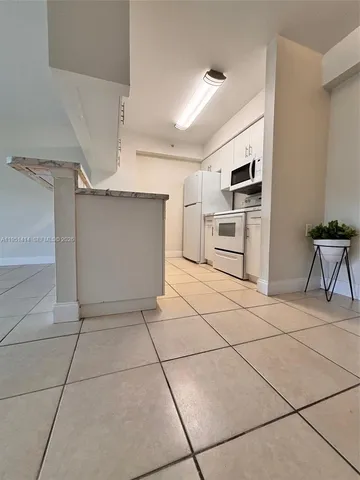 a kitchen with stainless steel appliances a sink and a stove