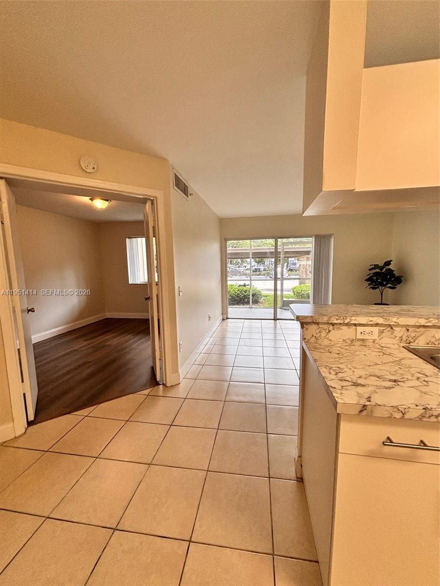 450 South Park Road, Unit 5104 Hollywood, FL 33021 - Photo 9 of 23 a bathroom with a granite countertop sink a toilet and vanity