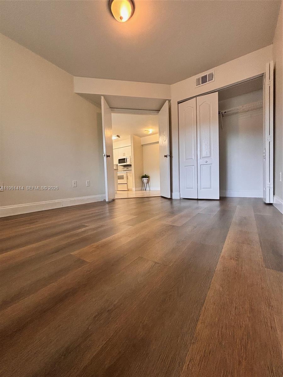 450 South Park Road, Unit 5104 Hollywood, FL 33021 - Photo 10 of 23 wooden floor in an empty room