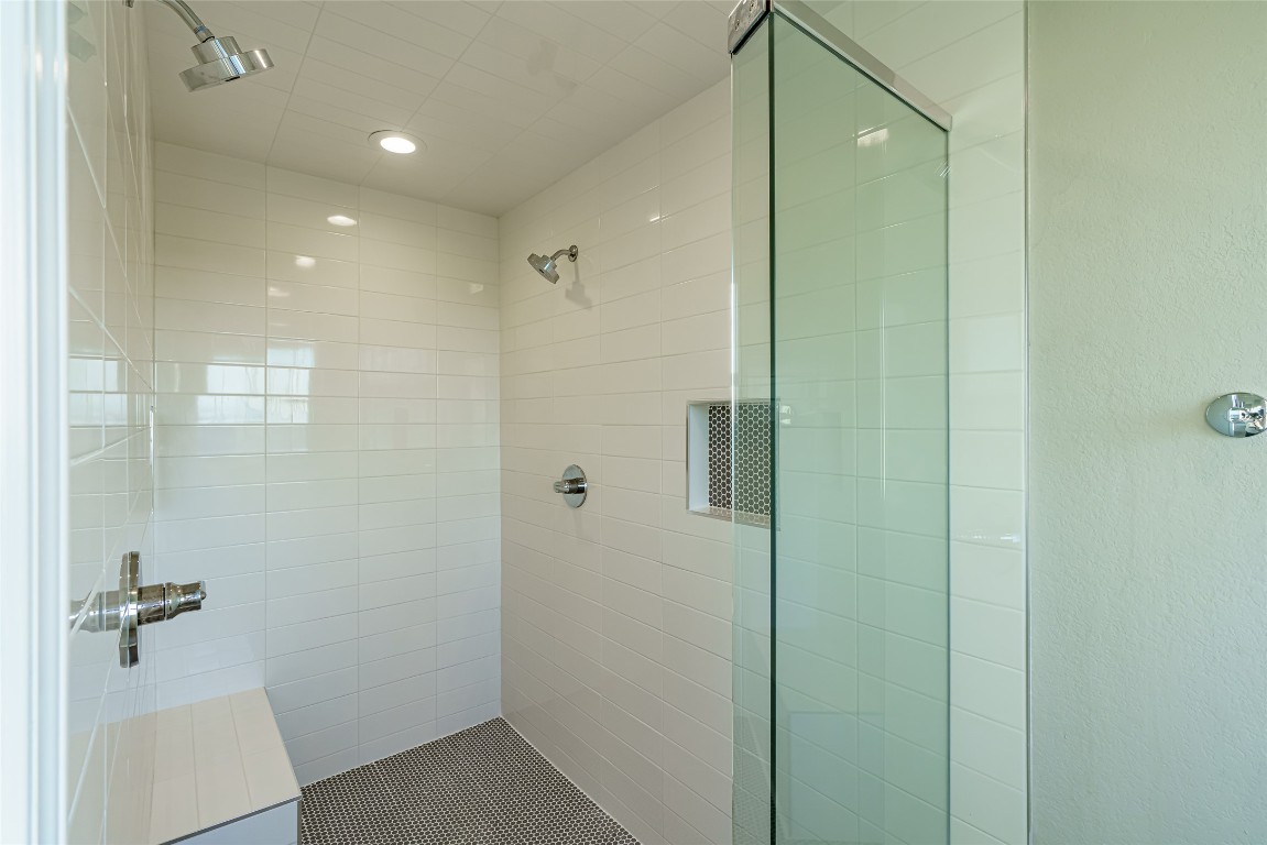 Undisclosed Address Dripping Springs, TX 78620 - Photo 11 of 19 a bathroom with a shower and a glass door