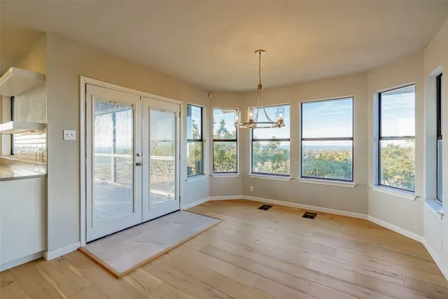a view of an empty room with a window