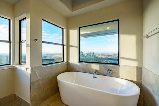 a bathroom with a bathtub and a shower