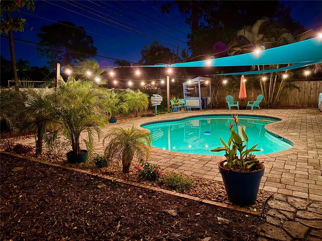 a view of a swimming pool with a patio