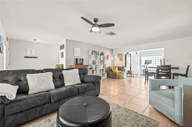 a kitchen with stainless steel appliances kitchen island granite countertop a stove a sink and a refrigerator