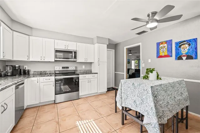 a bathroom with a shower and a sink