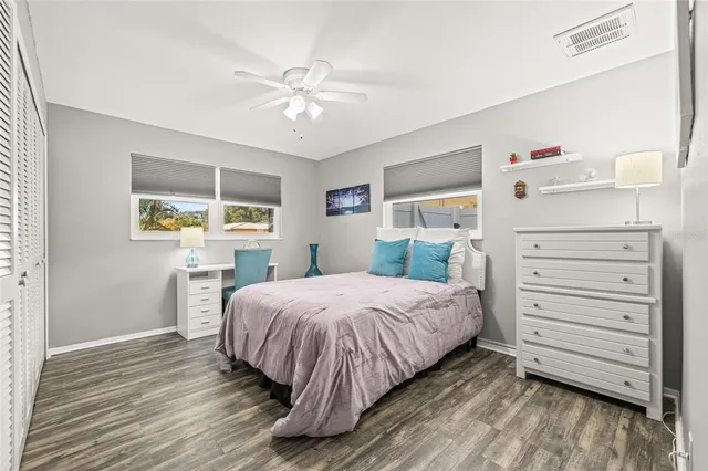 a bathroom with a toilet a sink and a window