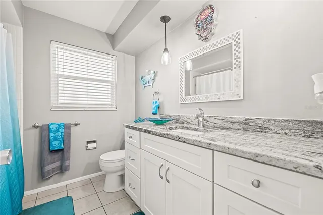 a bedroom with a bed and a shower