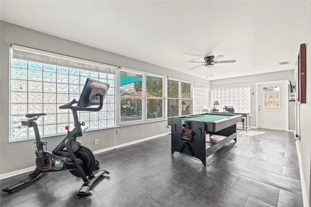 a view of a swimming pool with a patio