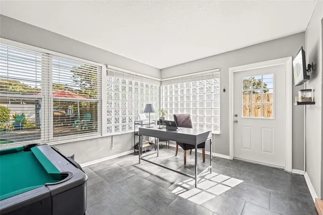 a view of a swimming pool with a porch