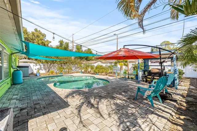 a view of a livingroom with furniture and a bookshelf